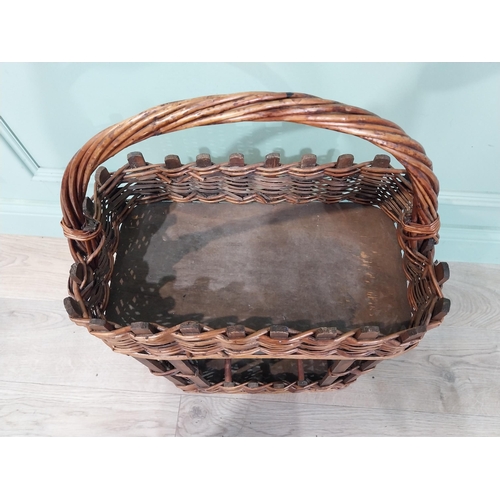 36 - Early 20th C. wicker wine rack and picnic basket. {70 cm H x 44 cm W x 24 cm D}.
