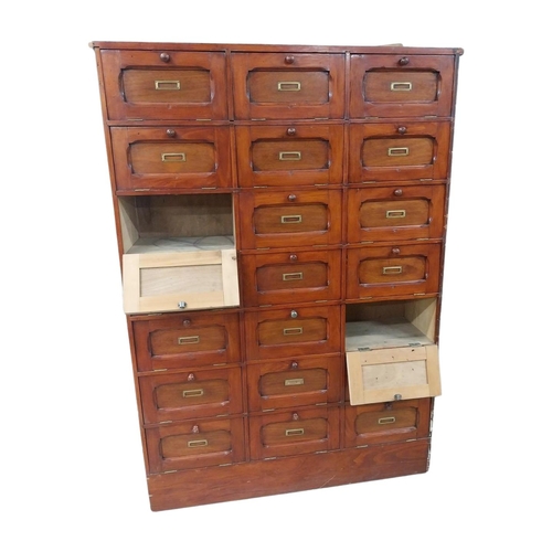 40 - Early 20th C. stained pine office cabinet with twenty one drop down doors with brass mounts. {171 cm... 