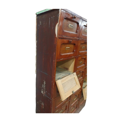 40 - Early 20th C. stained pine office cabinet with twenty one drop down doors with brass mounts. {171 cm... 