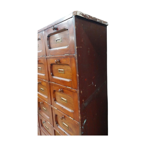 40 - Early 20th C. stained pine office cabinet with twenty one drop down doors with brass mounts. {171 cm... 