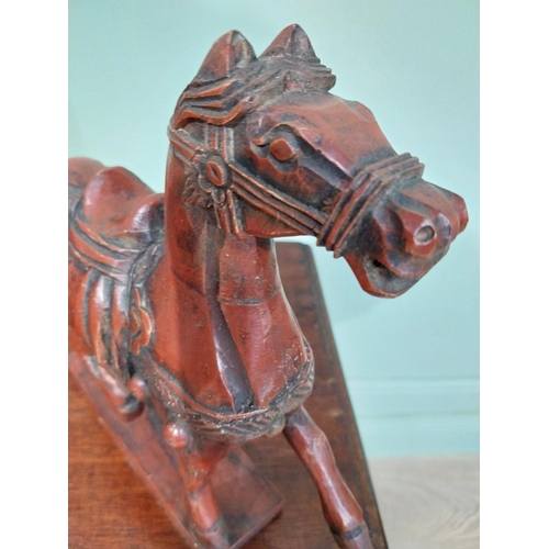 45 - Two carved painted pine models of Oriental Horses. {27 cm H x 28 cm W x 12 cm D}.