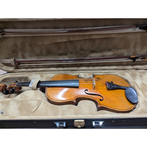 38 - German violin maker Antonius Stradivarius Cremonensis with case {62cm L x 21cm W x 4cm D}
