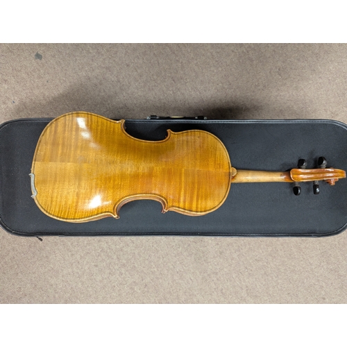38 - German violin maker Antonius Stradivarius Cremonensis with case {62cm L x 21cm W x 4cm D}