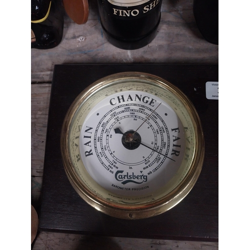 33 - Carlsberg brass clock and barometer mounted on mahogany plaque. {40 cm H x 19 cm W}.
