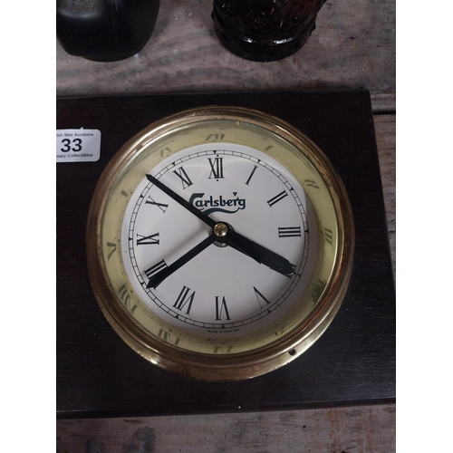 33 - Carlsberg brass clock and barometer mounted on mahogany plaque. {40 cm H x 19 cm W}.