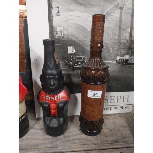 34 - Pisco Liquer ceramic bottle {27 cm H x 10 cm W x 9 cm D}, brown tooled leather advertising bottle {2... 