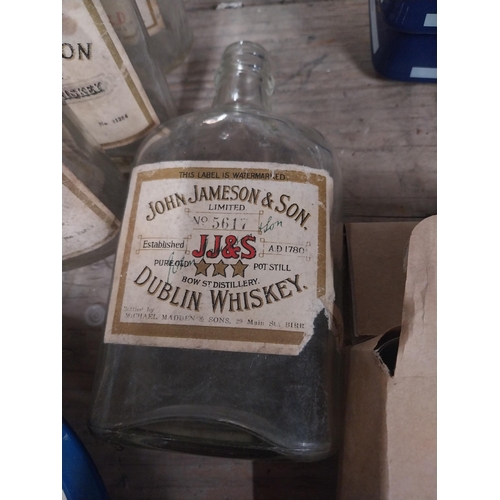 42 - Ten 1960's John Power and Sons bottles with original labels. {17 cm H x 9 cm W x 4 cm D}.