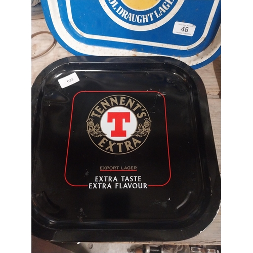 46 - Harp Lager and Tennent's Lager tin plate advertising drinks trays. {34 cm H x 34 cm W}.