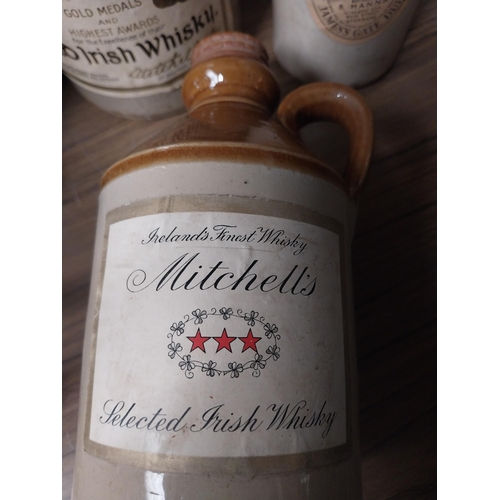 Three 19th C. stoneware flagons with Mitchell's Old Irish Whiskey ...