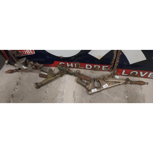 7 - Three early 19th C. brass and chrome cork pullers. {56 cm H x 7 cm W} approx.