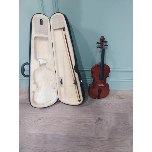 62 - Violin in case.
