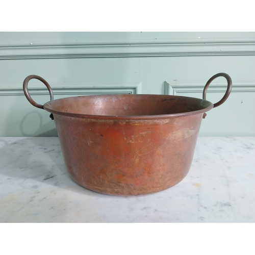 61 - Early 20th C. copper preserving pan with handles. {22 cm H x 34 cm W x 40 cm D}.