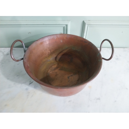 61 - Early 20th C. copper preserving pan with handles. {22 cm H x 34 cm W x 40 cm D}.