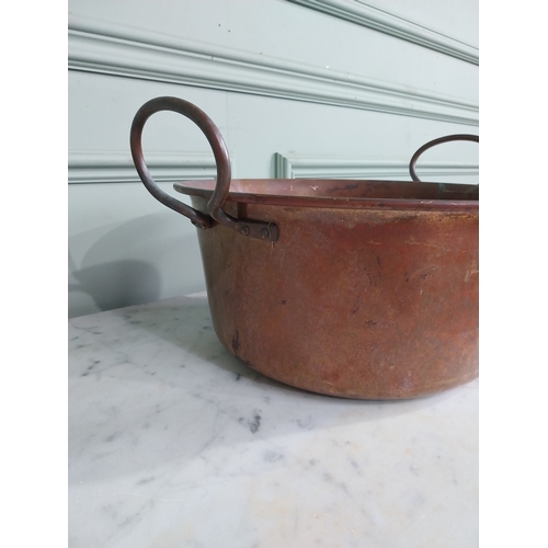61 - Early 20th C. copper preserving pan with handles. {22 cm H x 34 cm W x 40 cm D}.
