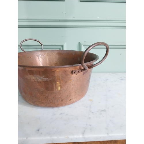 61 - Early 20th C. copper preserving pan with handles. {22 cm H x 34 cm W x 40 cm D}.