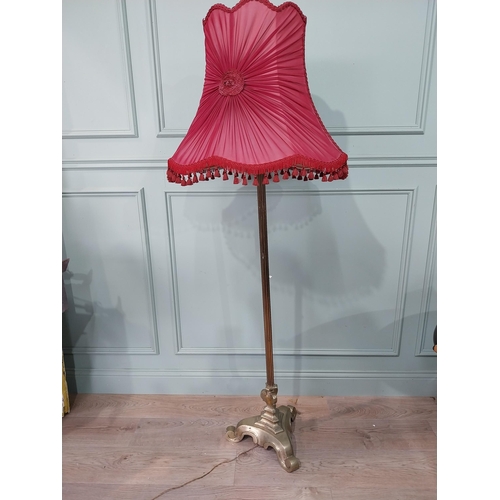 371 - 1950's brass standard lamp with cloth shade. {167 cm H x 60 cm W x 60 cm D}.