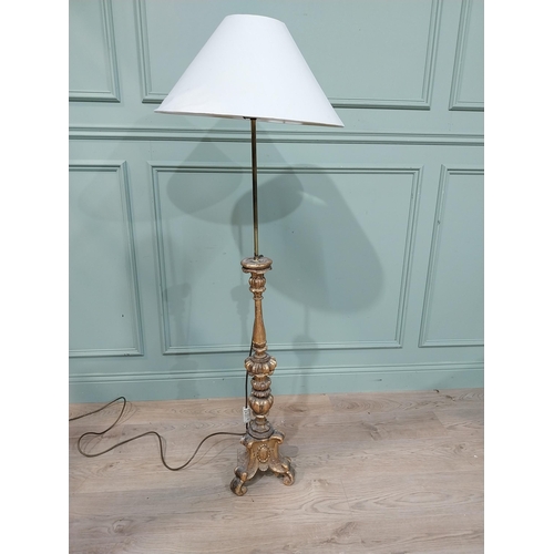 108 - 18th C. giltwood candlestick converted to standard lamp with cloth shade. {145 cm H x 51 cm Dia.}.