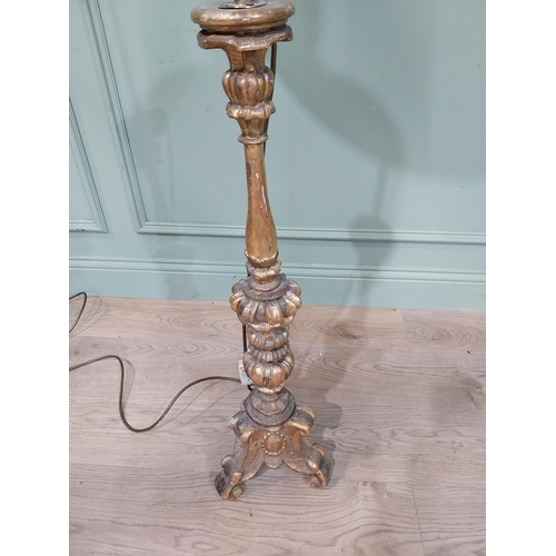 108 - 18th C. giltwood candlestick converted to standard lamp with cloth shade. {145 cm H x 51 cm Dia.}.