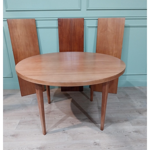 127 - Mid century dining table on square tapered legs. {73 cm H x 240 cm Dia} fully extended and {73 cm H ... 