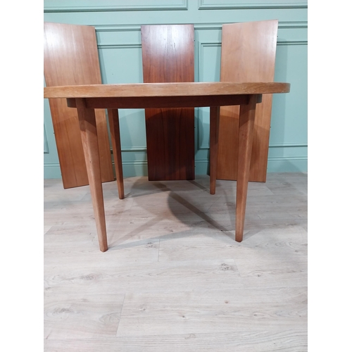 127 - Mid century dining table on square tapered legs. {73 cm H x 240 cm Dia} fully extended and {73 cm H ... 