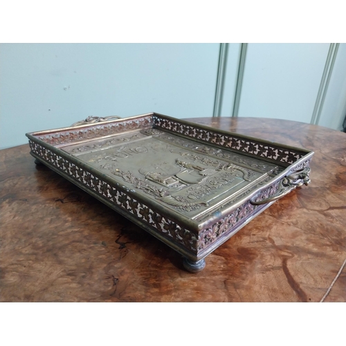 111 - Edwardian embossed brass Punch and Judy serving tray. {5 cm H x 36 cm W x 23 cm D}.
