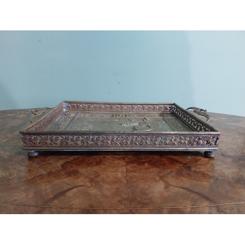 111 - Edwardian embossed brass Punch and Judy serving tray. {5 cm H x 36 cm W x 23 cm D}.