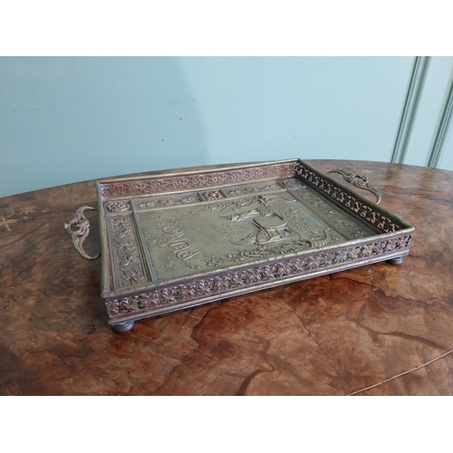 111 - Edwardian embossed brass Punch and Judy serving tray. {5 cm H x 36 cm W x 23 cm D}.