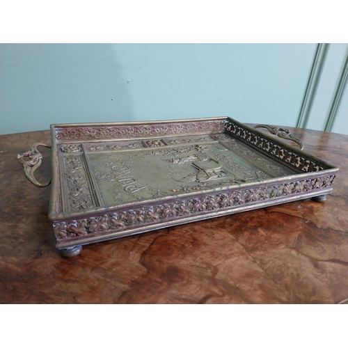 111 - Edwardian embossed brass Punch and Judy serving tray. {5 cm H x 36 cm W x 23 cm D}.