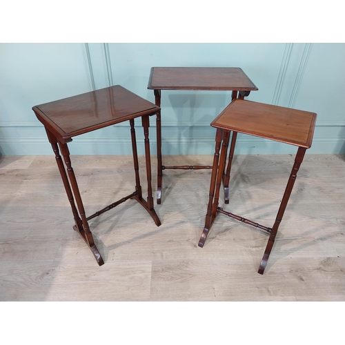 221 - Nest of three Edwardian mahogany tables on turned legs. {70 cm H x 50 cm W x 35 cm D}.
