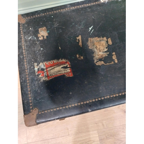 473 - Early 20th C. canvas travelling trunk with various Cunard Line and other labels. {32 cm H x 104 cm W... 