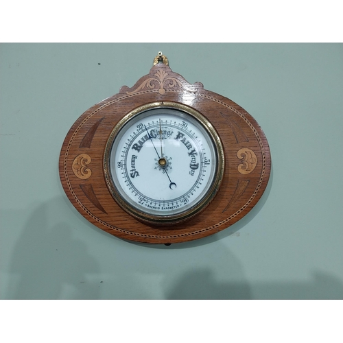 366 - Edwardian oak and satinwood inlaid barometer with enamel dial. {24 cm H x 27 cm Dia.}.