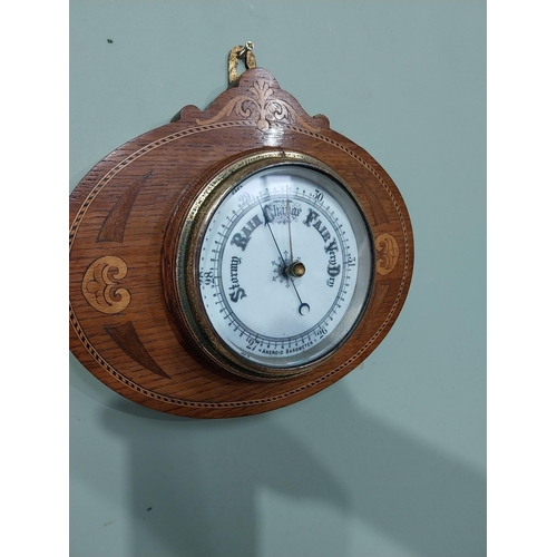 366 - Edwardian oak and satinwood inlaid barometer with enamel dial. {24 cm H x 27 cm Dia.}.
