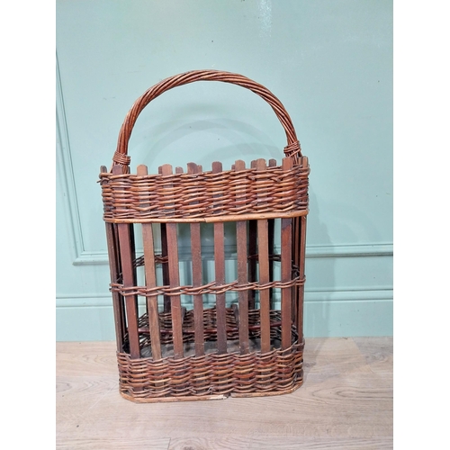 234 - Early 20th C. wicker wine rack and picnic basket. {70 cm H x 44 cm W x 24 cm D}.