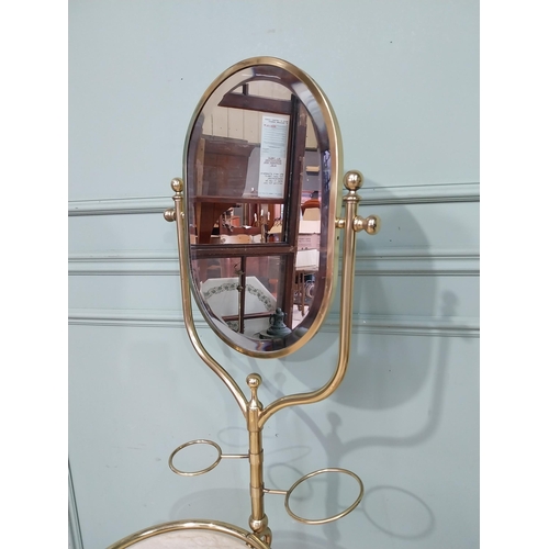 34 - Rare early 20th C. brass Gentleman's washstand with mirrored back and inset marble top with towel ra... 
