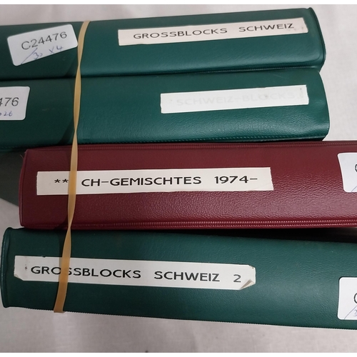 593 - Four albums of Helvetia stamps including sheet of 4 Switzerland 2000 World�s First Embroidery Stamps... 