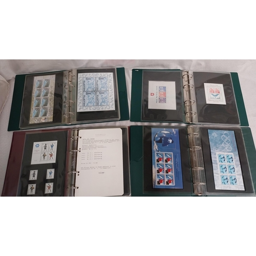 593 - Four albums of Helvetia stamps including sheet of 4 Switzerland 2000 World�s First Embroidery Stamps... 