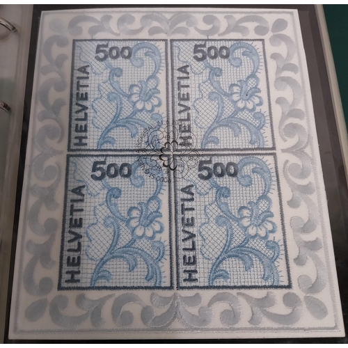 593 - Four albums of Helvetia stamps including sheet of 4 Switzerland 2000 World�s First Embroidery Stamps... 