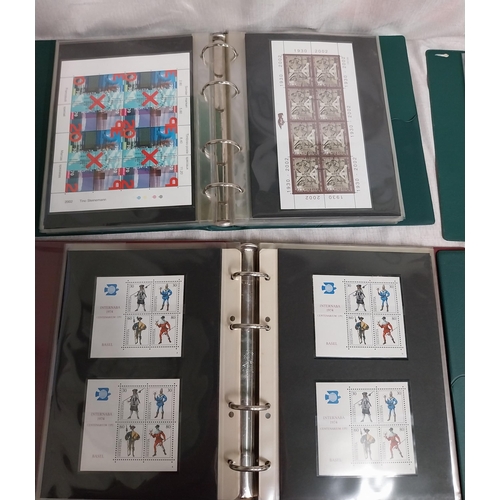 593 - Four albums of Helvetia stamps including sheet of 4 Switzerland 2000 World�s First Embroidery Stamps... 
