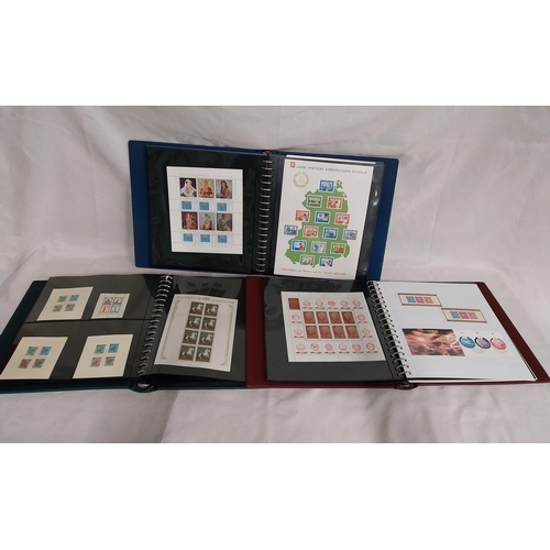 606 - Three albums of World stamps 1920 - 2004.