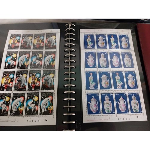 606 - Three albums of World stamps 1920 - 2004.