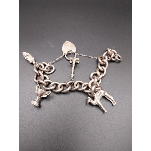 517 - Silver Charm Bracelet with charms. Hallmarked Birmingham 1972/73. Available to view on request.