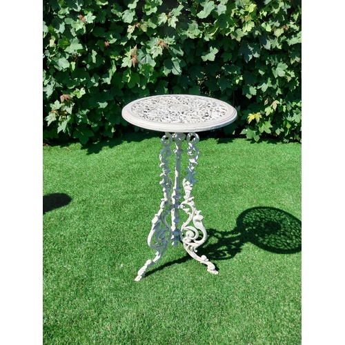 613 - Decorative cast iron garden table on three outswept legs. {69 cm H x 25 cm Dia.}.