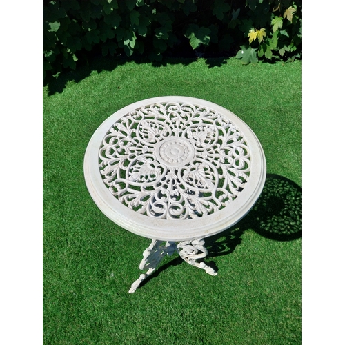 613 - Decorative cast iron garden table on three outswept legs. {69 cm H x 25 cm Dia.}.