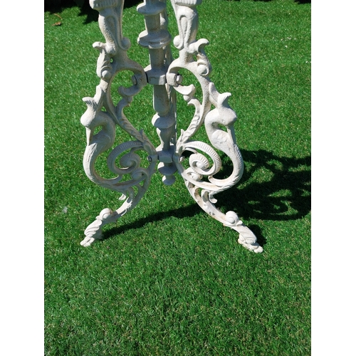 613 - Decorative cast iron garden table on three outswept legs. {69 cm H x 25 cm Dia.}.