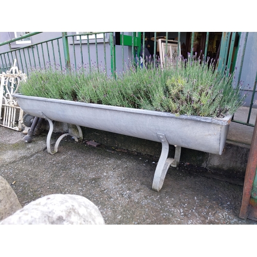 1200 - Early 20th C. galvanised planter on shaped legs. {64 cm H x 206 cm W x 66 cm D}.
