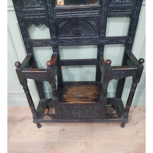 198 - Victorian carved oak hall stand with monk's bench seat. {239 cm H x 106 cm W x 40 cm D}.