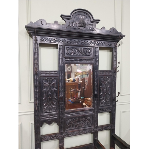 198 - Victorian carved oak hall stand with monk's bench seat. {239 cm H x 106 cm W x 40 cm D}.