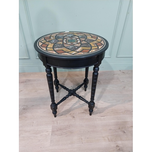 131 - Edwardian specimen marble occasional table on ebonised base. {72 cm H x 59 cm Dia.}.