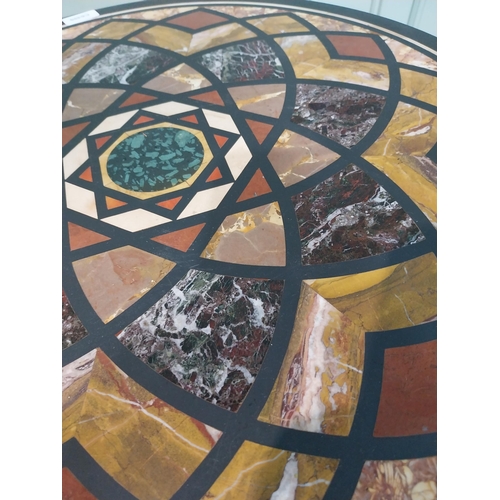 131 - Edwardian specimen marble occasional table on ebonised base. {72 cm H x 59 cm Dia.}.