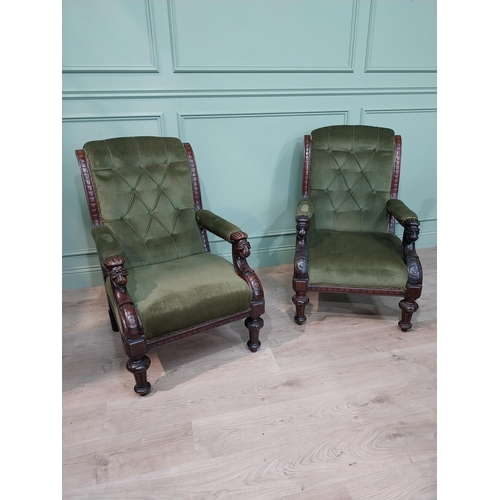 149 - Pair of Irish mahogany upholstered armchairs decorated with lion's masks on turned legs. {97 cm H x ... 